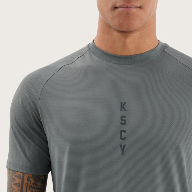 Model wears Fortify Raglan Dual Curved Active Tee Shadow/Jet Black T-Shirts in Grey - Image 3