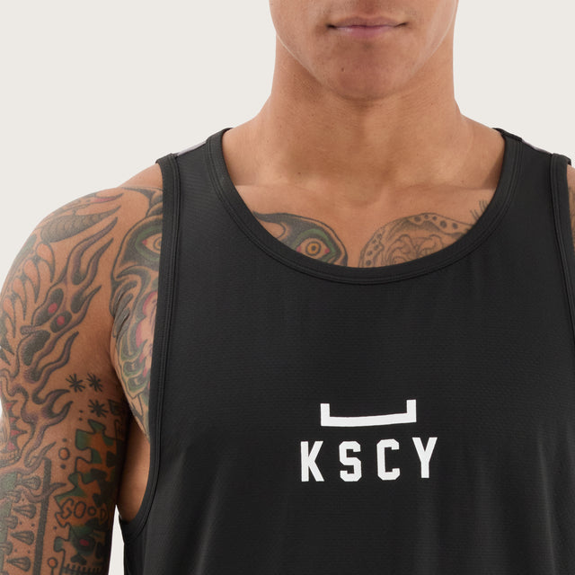 Model wears Bolster Curved Hem Active Tank Black/Asphalt Muscle Tees in Black - Image 3