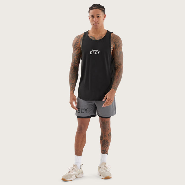 Model wears Bolster Curved Hem Active Tank Black/Asphalt Muscle Tees in Black - Image 6