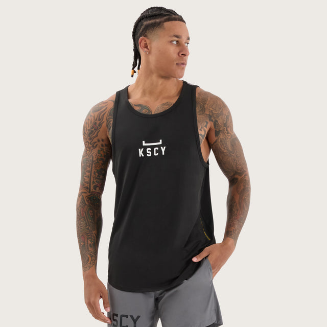 Model wears Bolster Curved Hem Active Tank Black/Asphalt Muscle Tees in Black - Image 1