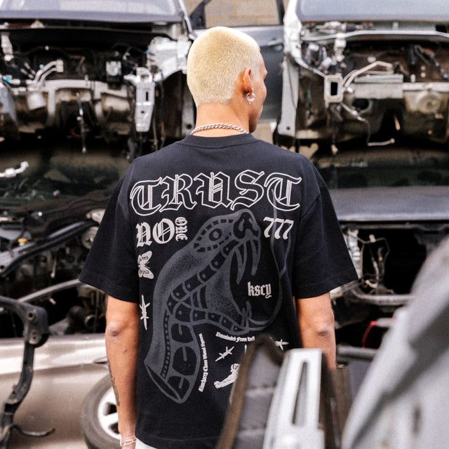 Model wears Trust Street Tee Anthracite T-Shirts in Black - Image 2