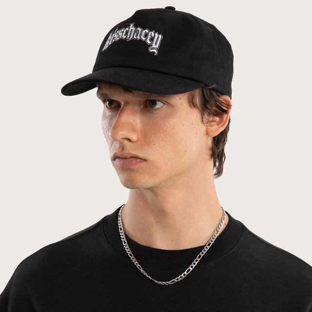 Model wears Archer Cap Jet Black Headwear in Black - Image 2