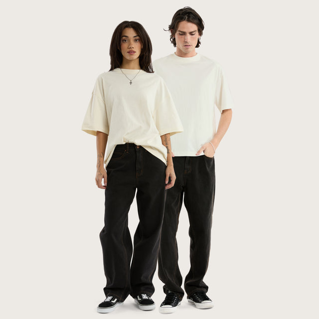 Model wears K6 Baggy Wide Leg Jean Washed Black Pants in Black - Image 1