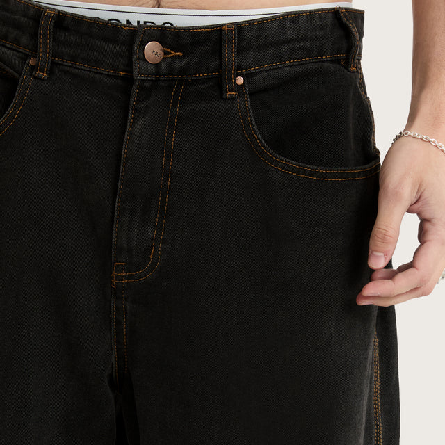 Model wears K6 Baggy Wide Leg Jean Washed Black Pants in Black - Image 4