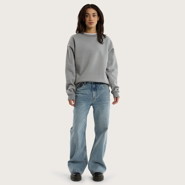Model wears Medora Relaxed Sweater Pigment Ultimate Grey Jumpers in Grey - Image 7