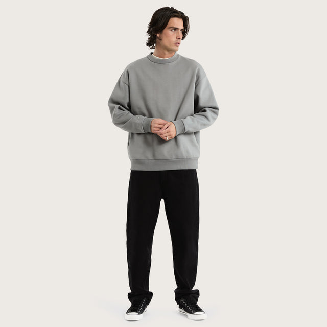 Model wears Medora Relaxed Sweater Pigment Ultimate Grey Jumpers in Grey - Image 5