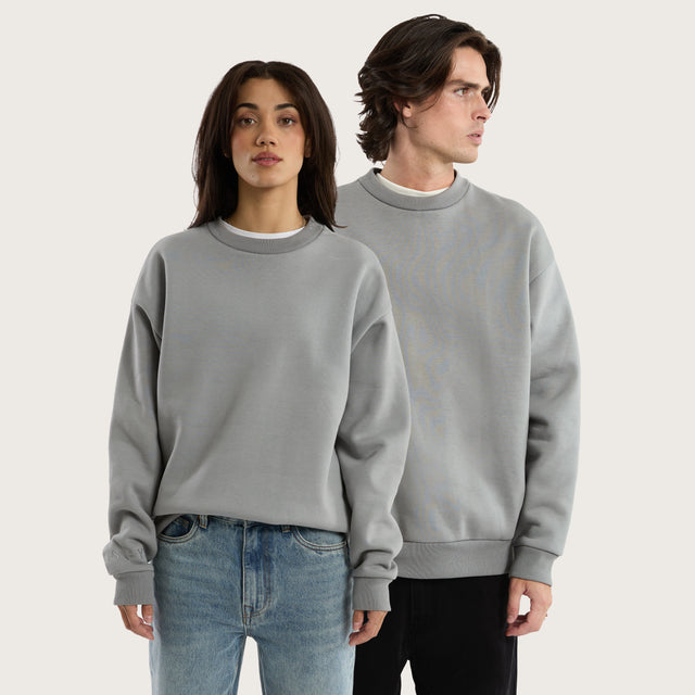 Model wears Medora Relaxed Sweater Pigment Ultimate Grey Jumpers in Grey - Image 1
