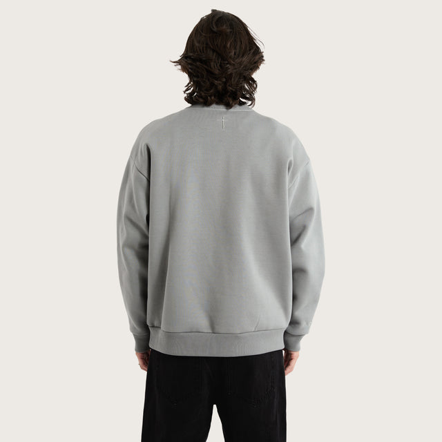 Model wears Medora Relaxed Sweater Pigment Ultimate Grey Jumpers in Grey - Image 2