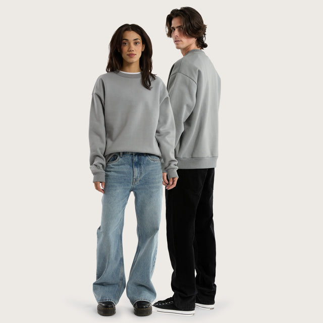 Model wears Medora Relaxed Sweater Pigment Ultimate Grey Jumpers in Grey - Image 6
