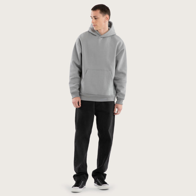 Model wears Weyburn Relaxed Hoodie Pigment Ultimate Grey Hoodies in Grey - Image 5