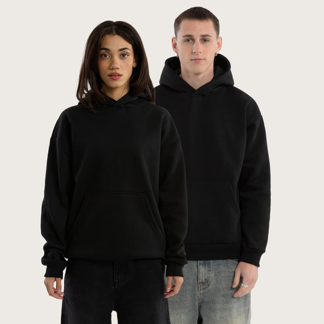 Model wears Weyburn Relaxed Hoodie Jet Black Hoodies in Black - Image 2