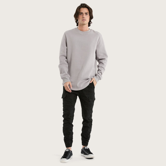 Model wears Miles Dual Curved Sweater Gull Jumpers in Grey - Image 2