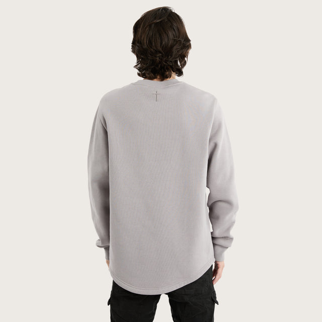 Model wears Miles Dual Curved Sweater Gull Jumpers in Grey - Image 4