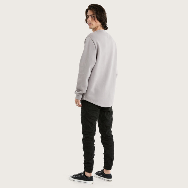 Model wears Miles Dual Curved Sweater Gull Jumpers in Grey - Image 5