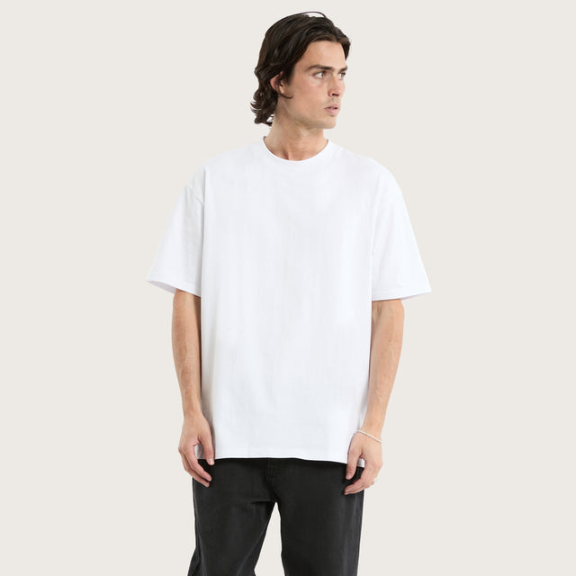 Model wears Brooks Heavy Box Fit Tee Optical White T-Shirts in White - Image 1