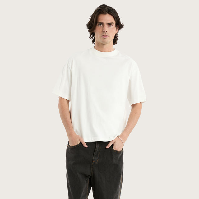Model wears Gillette Heavy Crop Tee Natural White T-Shirts in Off-White - Image 1