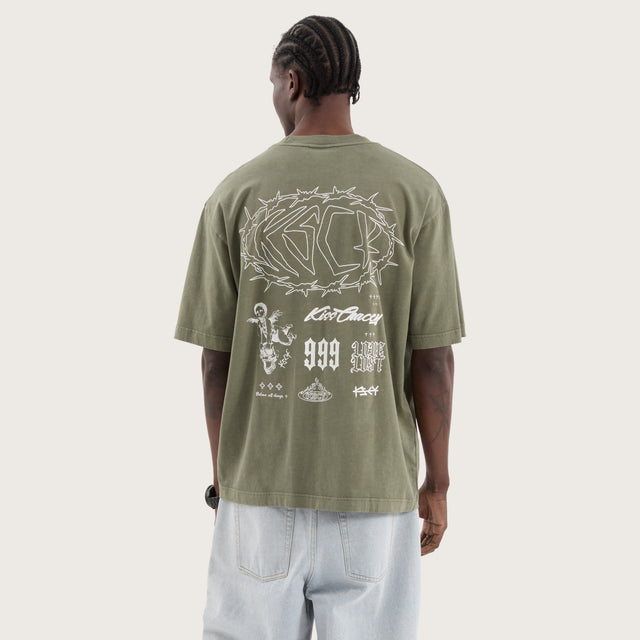 Model wears Adrift Oversized Tee Pigment Olive T-Shirts in Green - Image 1