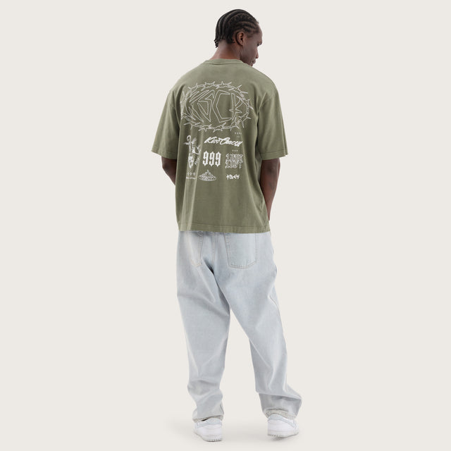 Model wears Adrift Oversized Tee Pigment Olive T-Shirts in Green - Image 5