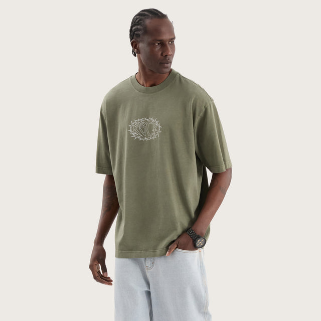 Model wears Adrift Oversized Tee Pigment Olive T-Shirts in Green - Image 2