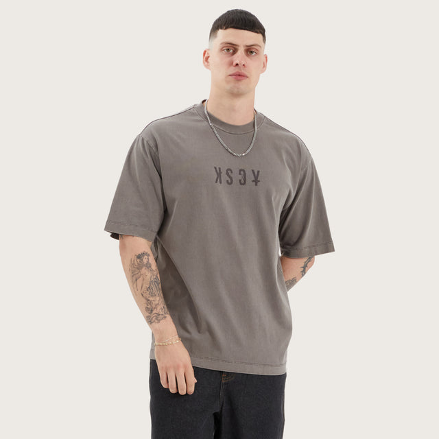 Model wears West Oversized Tee Pigment Iron T-Shirts in Brown - Image 4