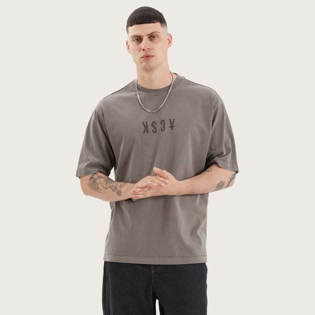 Model wears West Oversized Tee Pigment Iron T-Shirts in Brown - Image 1