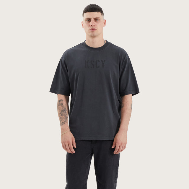 Model wears Wissle Oversized Tee Pigment Black T-Shirts in Black - Image 2
