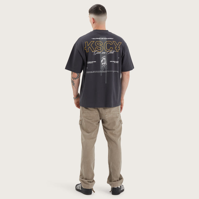 Model wears Aral Street Tee Pigment Anthracite T-Shirts in Black - Image 5