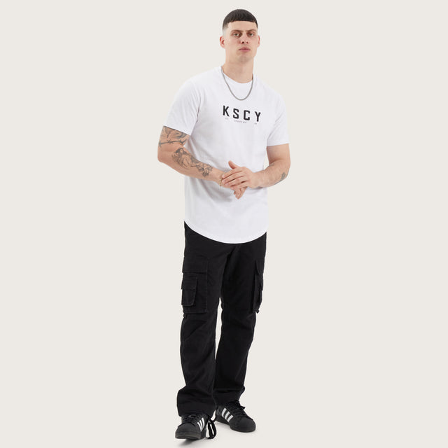 Model wears Ilment Dual Curved Tee Optical White T-Shirts in White - Image 4