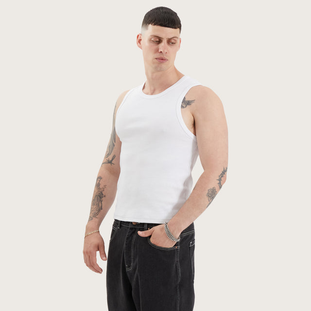 Model wears Baikal Relaxed Singlet Optical White Tanks in White - Image 1