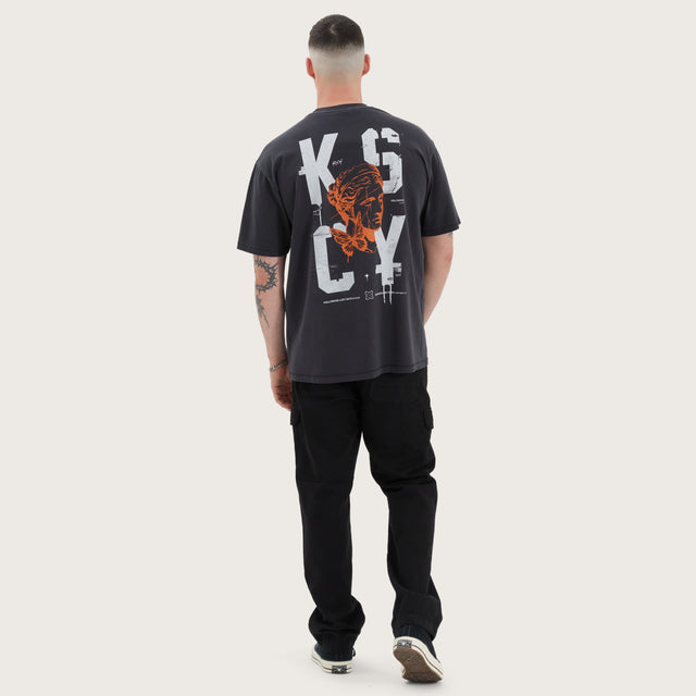 Model wears Untamed Box Fit Tee Pigment Black T-Shirts in Black - Image 4
