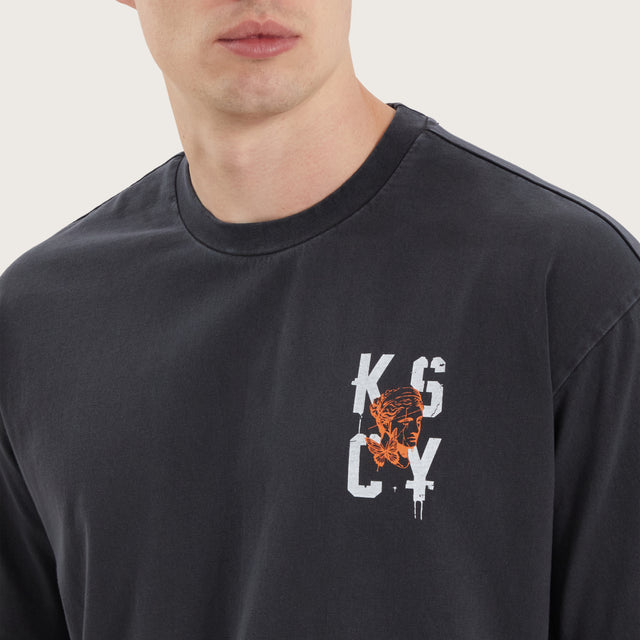 Model wears Untamed Box Fit Tee Pigment Black T-Shirts in Black - Image 3