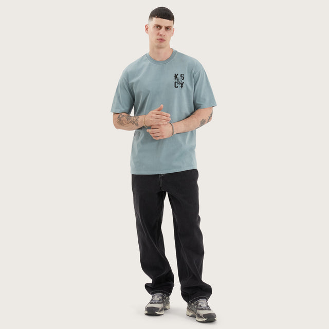 Model wears Untamed Box Fit Tee Pigment Lead T-Shirts in Green - Image 5
