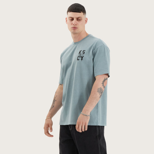 Model wears Untamed Box Fit Tee Pigment Lead T-Shirts in Green - Image 4