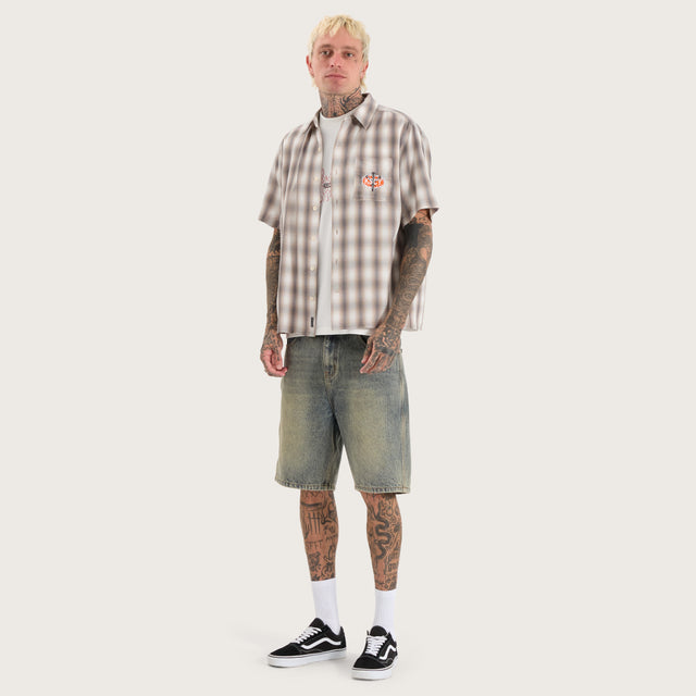 Model wears Titan Skate Shirt Iron White Check Short Sleeve Shirts in White - Image 5