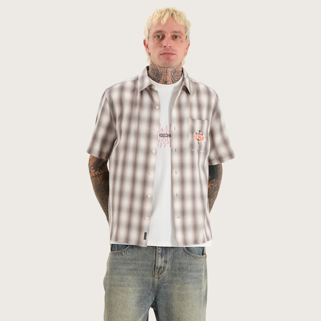 Model wears Titan Skate Shirt Iron White Check Short Sleeve Shirts in White - Image 1