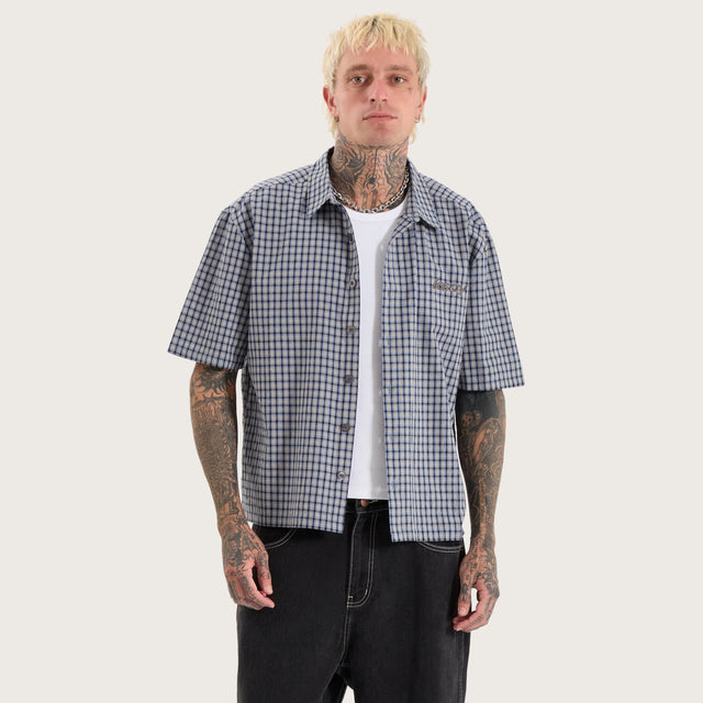 Model wears Skylar Oversized Dress Shirt Blue Check Short Sleeve Shirts in Blue - Image 1
