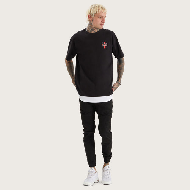 Model wears Unforward Box Fit Layer Tee Jet Black T-Shirts in Black - Image 4