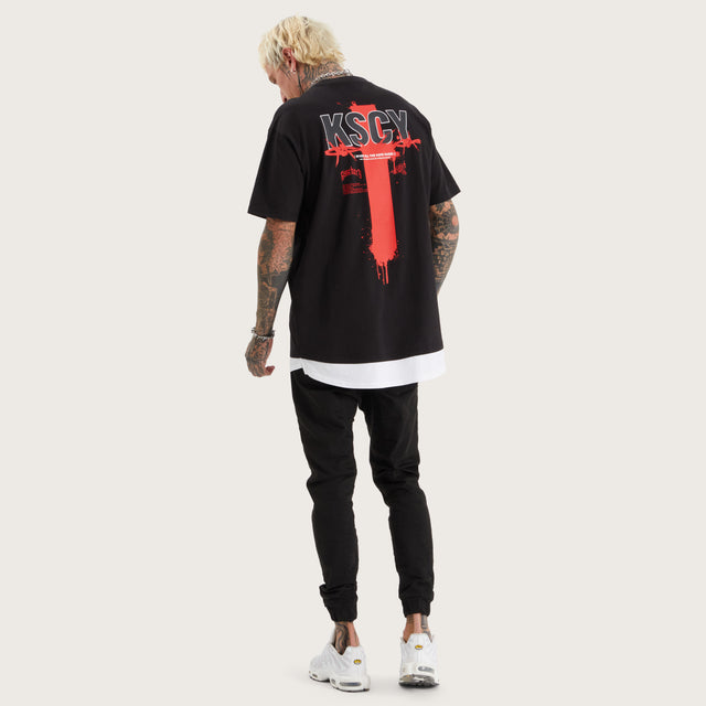 Model wears Unforward Box Fit Layer Tee Jet Black T-Shirts in Black - Image 5