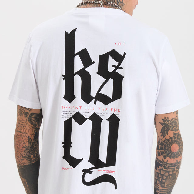 Model wears Defiant Standard Tee Optical White T-Shirts in White - Image 4