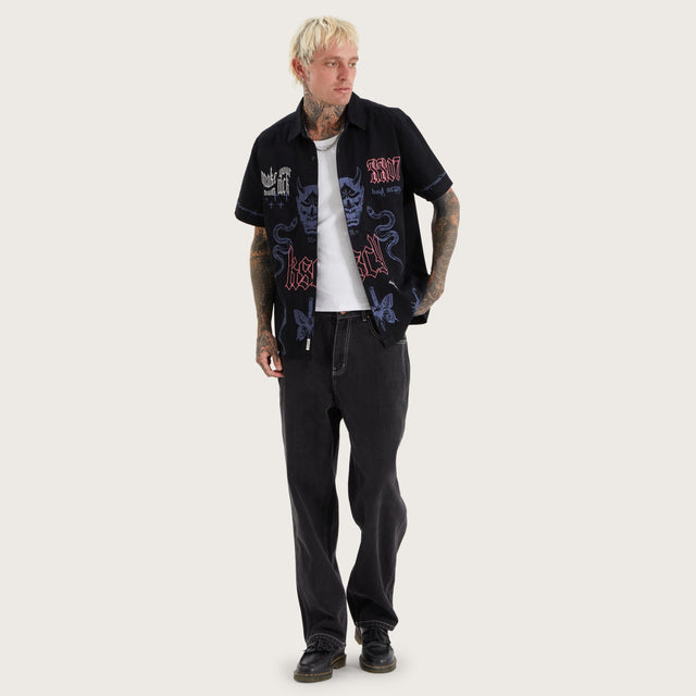 Model wears Menith Mechanic Shirt Jet Black Short Sleeve Shirts in Black - Image 6