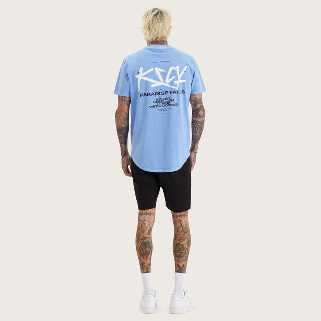 Model wears Luxor Dual Curved Tee Pigment Corn Flower T-Shirts in Blue - Image 5