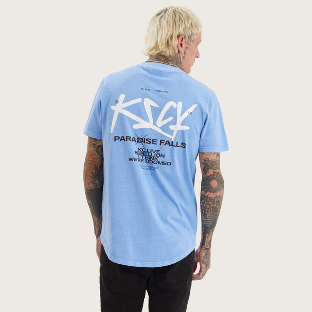 Model wears Luxor Dual Curved Tee Pigment Corn Flower T-Shirts in Blue - Image 2