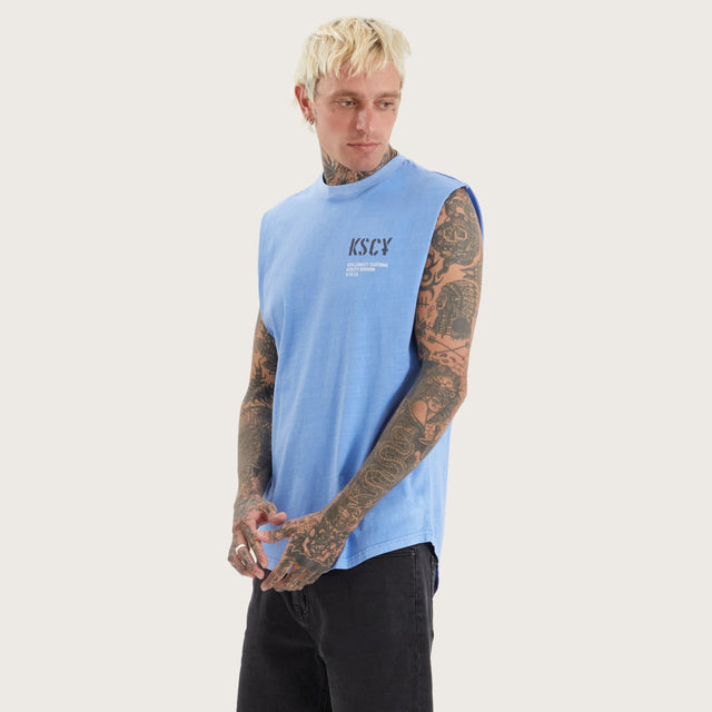 Model wears Harmon Dual Curved Muscle Pigment Corn Flower Muscle Tees in Blue - Image 1