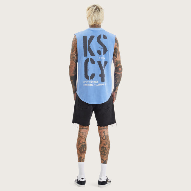 Model wears Harmon Dual Curved Muscle Pigment Corn Flower Muscle Tees in Blue - Image 5