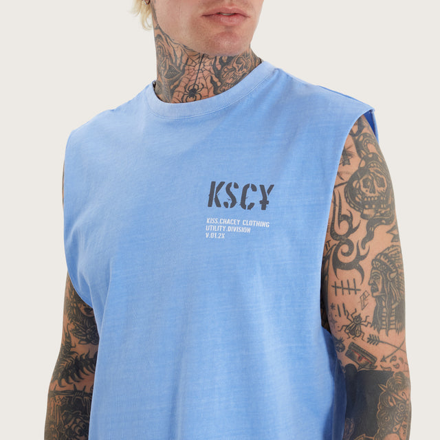 Model wears Harmon Dual Curved Muscle Pigment Corn Flower Muscle Tees in Blue - Image 3