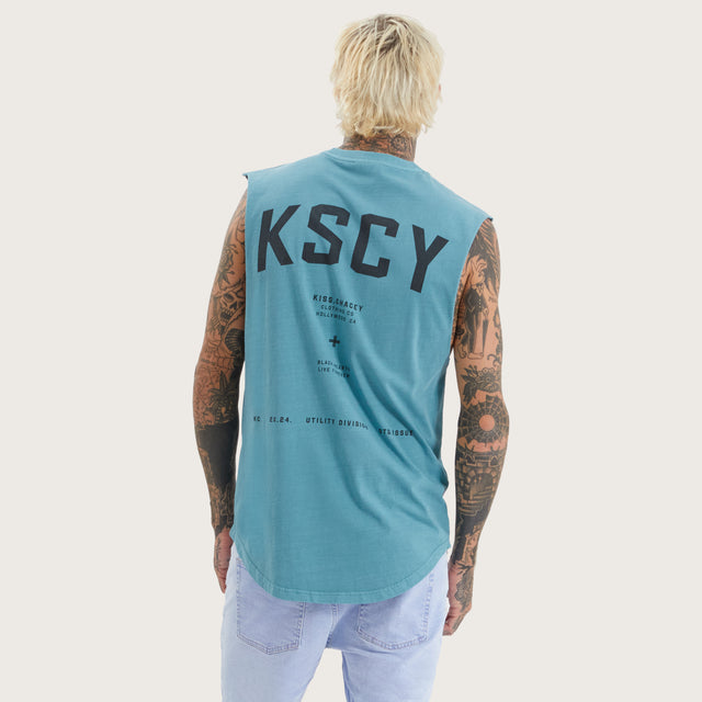 Model wears Nebo Dual Curved Muscle Pigment Brittany Blue Muscle Tees in Blue - Image 1