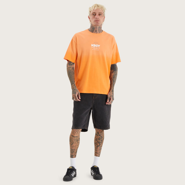 Model wears Cuffern Box Fit Tee Nectarine T-Shirts in Orange - Image 5