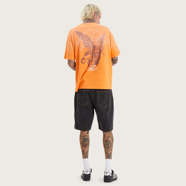 Model wears Cuffern Box Fit Tee Nectarine T-Shirts in Orange - Image 4