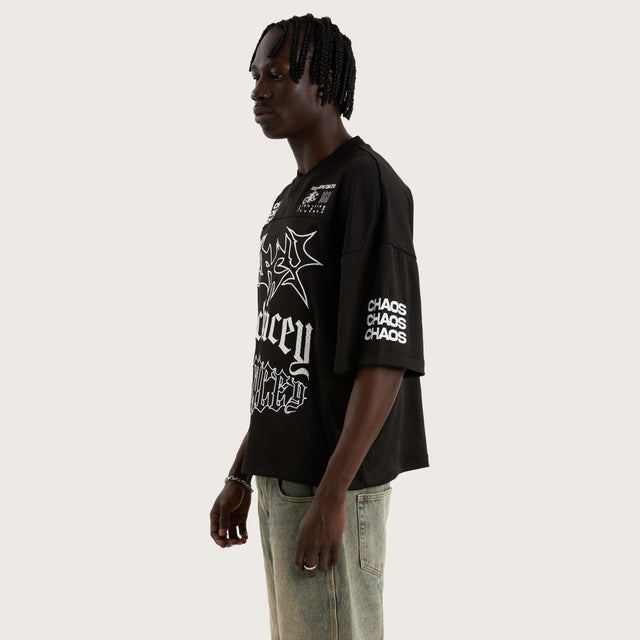 Model wears Teamwork Mesh Jersey Jet Black Jerseys in Black - Image 7