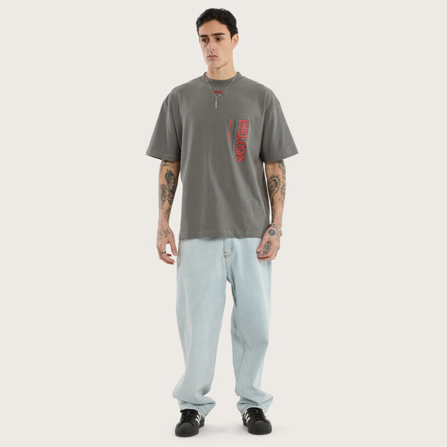 Model wears Infinite Street Tee Charcoal T-Shirts in Grey - Image 2